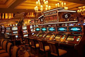 Live blackjack dealer on screen viewed by a Filipino player at night